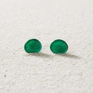 Close‑up of 12mm Capiz shell studs showing natural shimmer