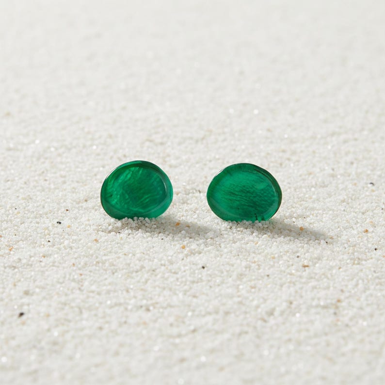 Close‑up of 12mm Capiz shell studs showing natural shimmer