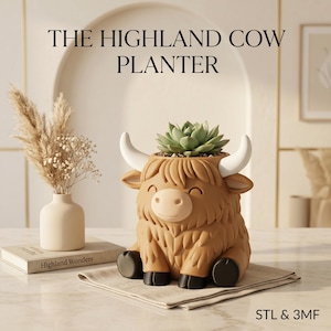 May include: A brown Highland cow planter with a succulent plant. The planter has white horns, black hooves, and a smiling face. The text "THE HIGHLAND COW PLANTER" is at the top of the image. The planter is sitting on a white cloth.