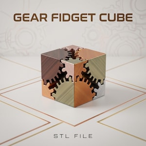 May include: A multi-colored gear fidget cube with the text "GEAR FIDGET CUBE" and "STL FILE". The cube is composed of interlocking gears in shades of brown, copper, silver, and gold. The gears are visible on each face of the cube.