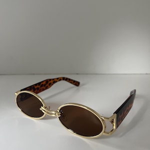 Monture rétro en métal doré, verres bruns ovales écaille de tortue | Lunettes de soleil marron | Nuances de noir
