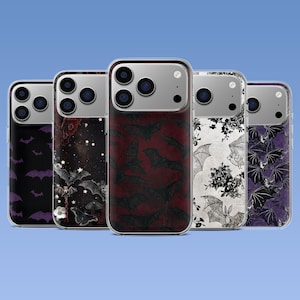 May include: Five smartphone cases arranged in a row, each featuring a distinct design. The patterns include purple bats on black, a starry night with bats and flowers, a dark red bat print, a white floral bat motif, and purple bats on a dark background.