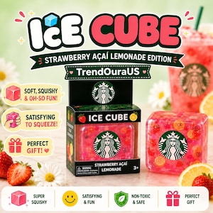 May include: A square, pink, translucent squishy toy shaped like an ice cube, featuring a green Starbucks siren logo. It is packaged in a black box labeled ICE CUBE STRAWBERRY AÇAI LEMONADE, decorated with strawberry and lemon graphics.