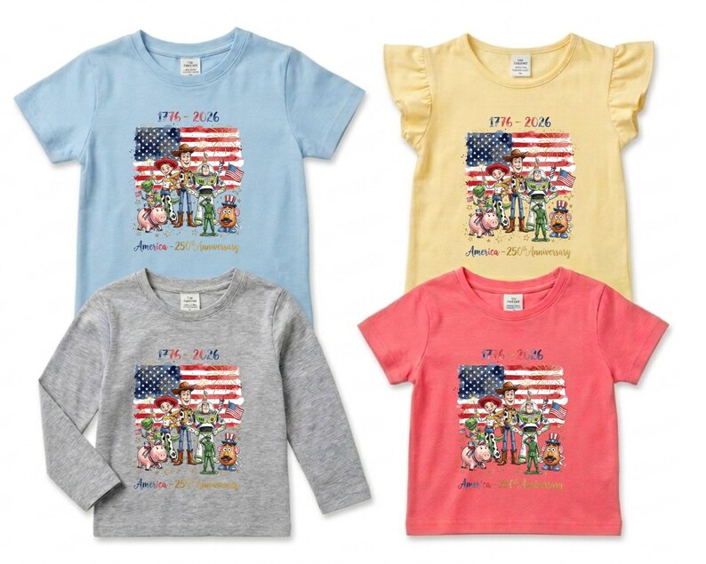 May include: Four children's t-shirts in light blue, yellow, gray, and coral. Each shirt features a graphic of the American flag and cartoon characters with the text "1776-2026" and "America - 250th Anniversary".