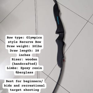 May include: Black Olympics style recurve bow with a wooden riser and fiberglass limbs. Draw weight is 20lbs, and draw length is 28 inches. The bow is designed for beginners and recreational target shooting.