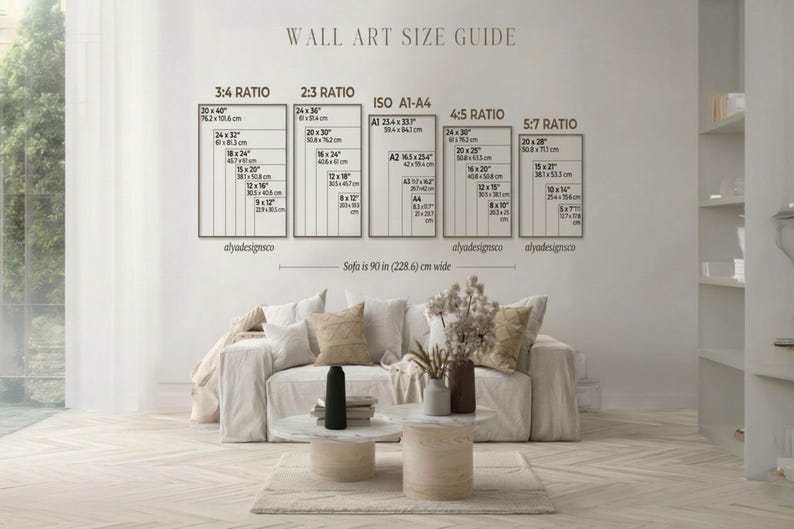 May include: A wall art size guide with dimensions in inches is displayed above a sofa. The guide includes ratios such as 3:4, 2:3, ISO A1-A4, 4:5, and 5:7, with corresponding sizes. The sofa is 90 inches wide.