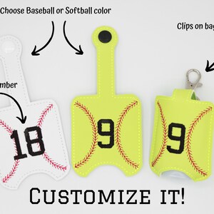 May include: Three hand sanitizer holders, one white, one yellow, and one green, with a baseball or softball design. Each holder has a number on it, 18, 9, and 9. The holders have clips to attach to a bag.  Customize It!