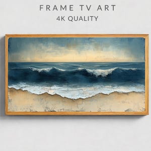 May include: A framed artwork showing an ocean scene with waves breaking on a sandy beach. The painting uses shades of blue and white for the water and light brown for the sand. The frame is light brown. Text at the top reads "FRAME TV ART 4K QUALITY."