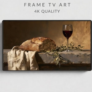 May include: Digital artwork for a frame TV titled FRAME TV ART 4K QUALITY. The image depicts a still life with a loaf of crusty bread on a draped beige cloth, a glass of red wine, and green olive branches on a stone surface against a brown background.