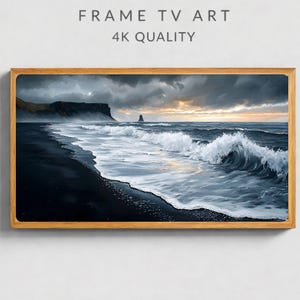 May include: A rectangular digital artwork titled FRAME TV ART 4K QUALITY featuring a landscape scene of a dark, moody ocean with white crashing waves hitting a black sand beach under a cloudy, sunset sky, enclosed in a light wood frame.