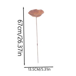 May include: A copper-colored metal flower garden stake with a textured, bowl-shaped bloom on a thin stem. The item measures 26.37 inches in total height and 5.31 inches in width, as indicated by the measurement text printed on the image.