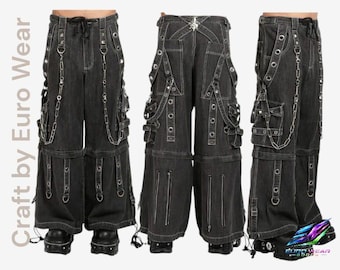 May include: Black denim pants with multiple pockets, straps, and silver chain accents. The pants feature a drawstring waist and zippers on the legs. The design includes metal grommets and decorative stitching. The pants are part of the Euro Wear collection.