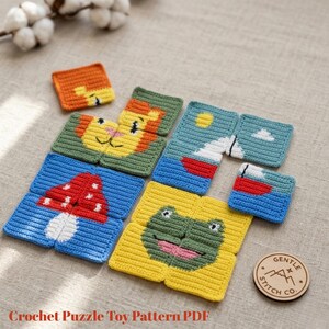 May include: A collection of colorful, crocheted puzzle pieces. The pieces depict a lion, a mushroom, a frog, and a landscape with a sun and boat. The text "Crochet Puzzle Toy Pattern PDF" is visible at the bottom. A wooden circle with the text "Gentle Stitch Co." is also visible.