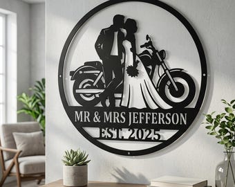 May include: A circular black metal wall sign featuring a silhouette of a couple standing next to a motorcycle. The text MR & MRS JEFFERSON and EST. 2025 is cut out from the bottom section of the circular frame, which includes mounting holes.