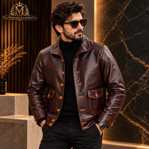 Vintage-inspired men’s jacket crafted from cowhide with a warm brown appearance, button front construction, structured silhouette and classic detailing for sophisticated everyday styling.
#VintageMenswear #CowhideJacket #MensWear #MensFashion #ClassicJacket #BrownStyle #MensOuterwear #RetroJacket #Cowhide #MensStyle #VintageFashion #ClassicMenswear #MensClothing #GiftForHim #RetroStyle #JacketFashion #MensApparel #HeritageWear #TimelessStyle #BrownJacket
ALT Text 4