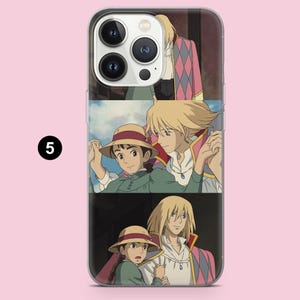 May include: Clear phone case featuring a colorful anime-style illustration. The design showcases multiple panels with characters in various scenes. The case has a glossy finish and is designed to fit a smartphone.