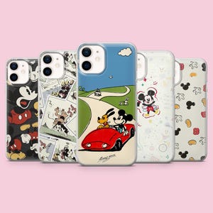 May include: Five phone cases with various designs. One case shows Mickey Mouse and Pluto in a red car on a road. Other cases feature Mickey Mouse, comic strip panels, and Mickey Mouse icons. The cases are on a pink background.
