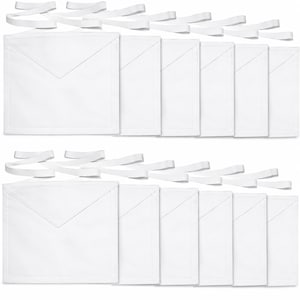 May include: A set of twelve plain white ceremonial aprons arranged in two rows of six. Each apron features a square body with a triangular flap at the top and attached white fabric ties for securing the garment around the waist.