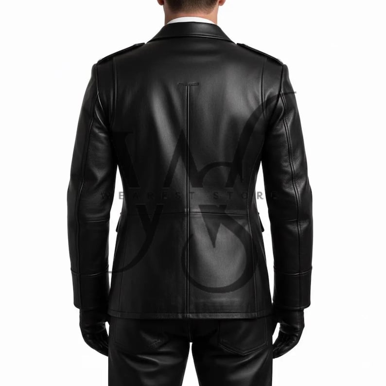 May include: A black leather jacket with a tailored fit, featuring a notched collar, shoulder epaulets, and a double-breasted design. The jacket has two front pockets and is worn with black gloves and pants. The back of the jacket has vertical seams.