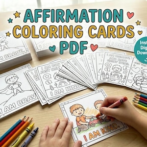 May include: A collection of affirmation coloring cards with the text "I AM BRAVE" and "I AM KIND". The cards feature line drawings of children and positive affirmations. Colored pencils and crayons are also visible.
