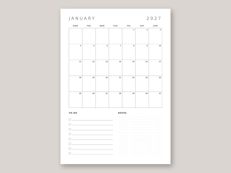 May include: A white monthly calendar page for January 2027 with a black grid layout. The top section displays the month and year, followed by a grid of days from Monday to Sunday. The bottom section includes a to-do list with checkboxes and a dotted notes area.