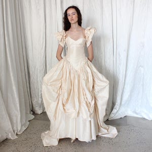 May include: A rustic wooden sign with the text "Welcome to our home" in white lettering. The sign features a distressed finish and a simple, inviting design, perfect for entryway decor.