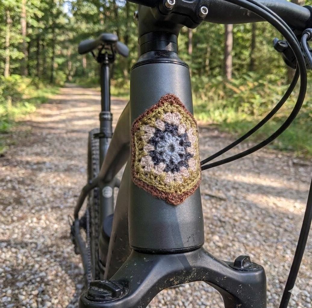 9 Bicycle Crochet Patterns for Bikes, Decor, Gifts, and Cozy Home Projects 5 Crocheted Bicycle Head Tube Badge: Granny Square
