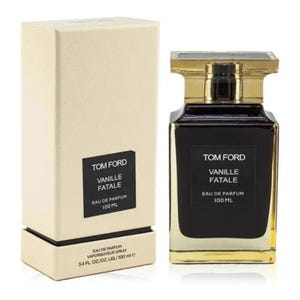May include: A Tom Ford "Vanille Fatale" Eau de Parfum bottle and box. The rectangular perfume bottle is dark brown with a gold cap. The box is beige with a black label that reads "Tom Ford Vanille Fatale Eau de Parfum 100 ML".