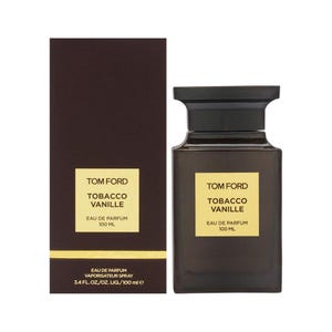 May include: A dark brown Tom Ford fragrance bottle and box set. The bottle has a black cap and a gold label with the text "TOBACCO VANILLE". The box has the same label and text. The bottle contains 100 ml of Eau de Parfum.