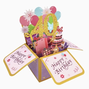 May include: A pop-up birthday card with a gold glitter "40" in the center. The card features a cake, gifts, balloons, and the words "Happy Birthday". The card is in a box shape with a purple and gold colour scheme.