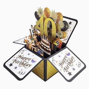 May include: A pop-up birthday card with a gold glitter "40" and a chocolate cake with candles. The card features gold, black, and white accents, with "Happy Birthday" text and star and cupcake illustrations. Balloons and gift boxes are also visible.