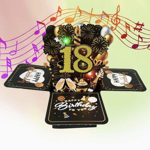 May include: A black and gold pop-up birthday card, featuring the number 18 in gold glitter. The card is decorated with balloons, fireworks, champagne glasses, and a cake. The words "Happy Birthday to You" are also visible.