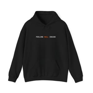 May include: Black hoodie with a front pocket and drawstring hood. The text "FEELING NULL INSIDE" is printed across the chest in white and orange. A casual, comfortable sweatshirt.