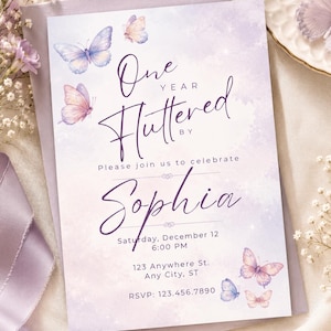 May include: A lavender and white birthday invitation with butterfly illustrations. The invitation reads "One Year Fluttered By" and invites guests to celebrate Sophia's birthday on December 12th at 6:00 PM. RSVP information is included.