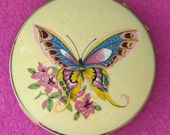 Vintage Stratton Butterfly make up compact with original sales receipt included.
