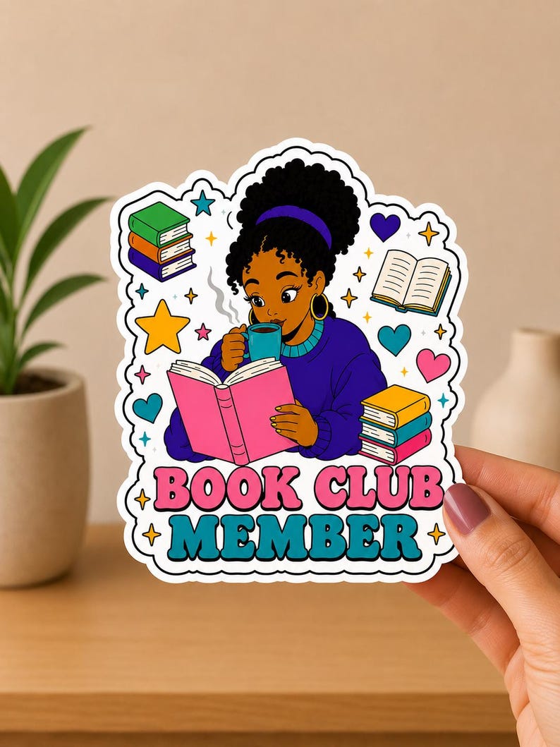 May include: A sticker featuring a cartoon illustration of a person reading a book and drinking from a mug. The sticker has the text "BOOK CLUB MEMBER" in pink and teal. Surrounding the illustration are books, stars, and hearts.