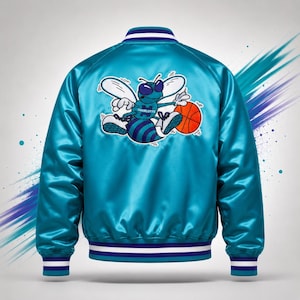 May include: A teal satin bomber jacket with white, blue, and teal striped trim. The back features a cartoon bee graphic holding a basketball, with the word "Charlotte" on the bee's jersey. The jacket has a shiny, smooth texture.