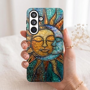 May include: A smartphone case featuring a stained glass style design of a golden sun and a blue crescent moon with closed eyes. The artwork is composed of textured segments in shades of teal, gold, and deep blue, separated by dark outlines.