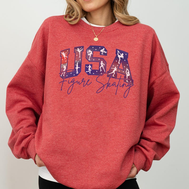 Red USA Figure Skating sweatshirt with patriotic skater silhouettes, cozy winter sports crewneck for skating moms, ice skating competition fan apparel.