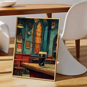 May include: A framed print depicting a pub scene with a pint of Guinness on a wooden bar. The artwork features a stained-glass window, a clock, and various framed signs. The color palette includes shades of blue, red, and brown.