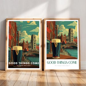 May include: Two framed art prints featuring a stylized illustration of a pint of stout in front of a cityscape. The prints have a wooden frame and the text "GOOD THINGS COME - TO THOSE WHO WAIT". The artwork has a vintage travel poster aesthetic.