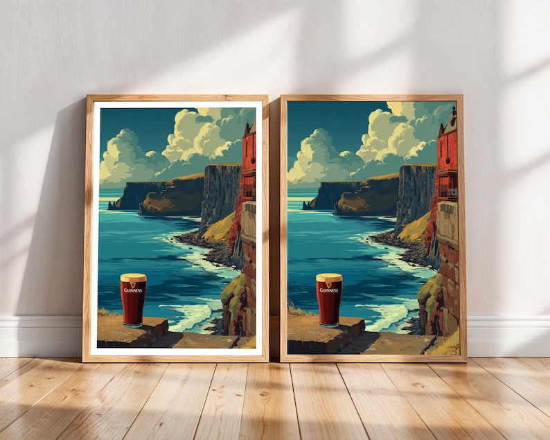 May include: Two framed art prints featuring a pint of Guinness stout set against a scenic coastal landscape with cliffs, ocean, and sky. The artwork has a vintage, illustrative style with a warm color palette.