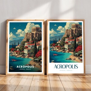 May include: Two framed art prints showcasing the Acropolis in Athens, Greece. The artwork presents a coastal view with buildings, boats, and the Parthenon on a cliff. The prints have a vintage travel poster aesthetic, with the word "ACROPOLIS" at the base of each image.
