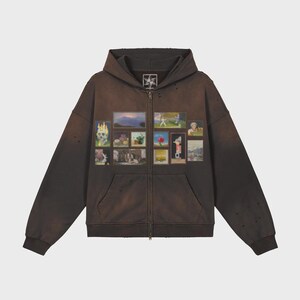 May include: Brown zip-up hoodie with a distressed, vintage appearance. The front displays a collage of framed images. The hoodie has a hood, pockets, and a zip closure. The sleeves and body have a faded look with intentional distressing.