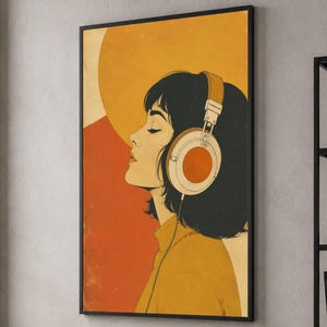 May include: A framed vertical wall art print featuring a stylized illustration of a person with dark hair in profile, wearing large over-ear headphones. The color palette consists of warm shades of orange, yellow, and cream with a solid black frame.