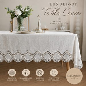 May include: A white rectangular table cover featuring an intricate embroidered pattern and a scalloped lace border. The text on the image reads: LUXURIOUS Table Cover ELEGANCE FOR EVERY OCCASION, EXQUISITE LACE DETAIL, 100% PREMIUM COTTON, DELICESHARM.