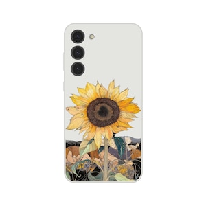 Peut inclure: Coque de téléphone avec une illustration de tournesol. Le tournesol a des pétales jaunes et un centre brun foncé. Le fond est gris clair avec un paysage en bas. La coque a un appareil photo et un flash.