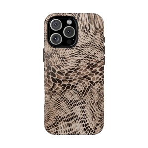 May include: A smartphone case featuring a snakeskin design in brown and beige tones. The case has a shiny surface and a raised border around the camera lenses. The case is designed to fit a mobile phone.
