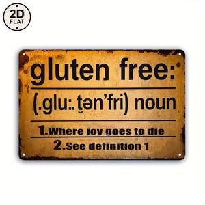 Puede incluir: Un letrero rectangular de metal con un acabado desgastado y oxidado en tonos naranja y marrón. El texto dice: gluten free: (.glu:.tən'fri) noun 1.where joy goes to die 2.See definition 1. Tiene cuatro pequeños orificios en las esquinas.