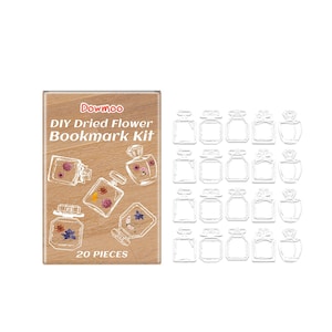 Könnte beinhalten: Ein Dowmoo DIY Dried Flower Lesezeichen-Set mit einer rechteckigen Schachtel in Holzoptik, weißem Text und Abbildungen von parfümflaschenförmigen Lesezeichen mit Trockenblumen, dazu 20 durchsichtige, leere Lesezeichen-Rohlinge.